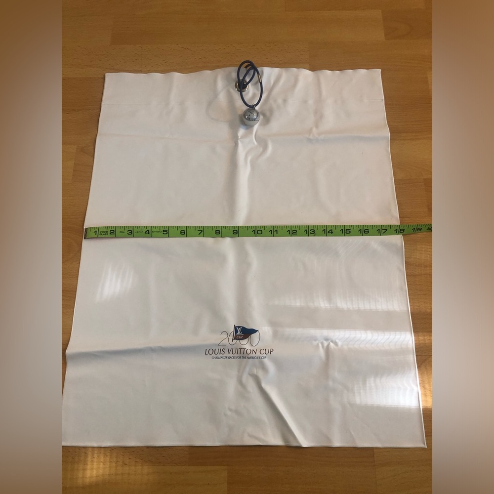 Louis Vuitton White Rubberized Drawstring Bag with compass to close it